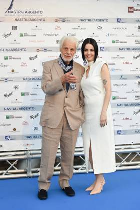 Italian actor and director Michele Placido and his wife Federica