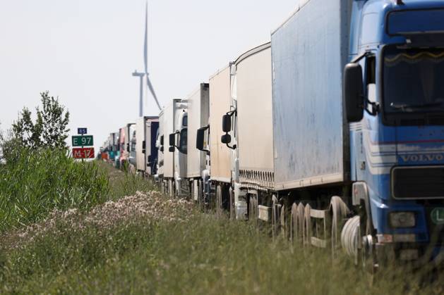 RUSSIA, KHERSON REGION - JUNE 23, 2023: Vehicles queue to pass the ...