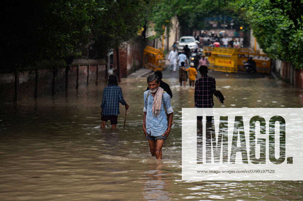 July 14 2023 New Delhi Delhi India A Man Wades Through A Flooded