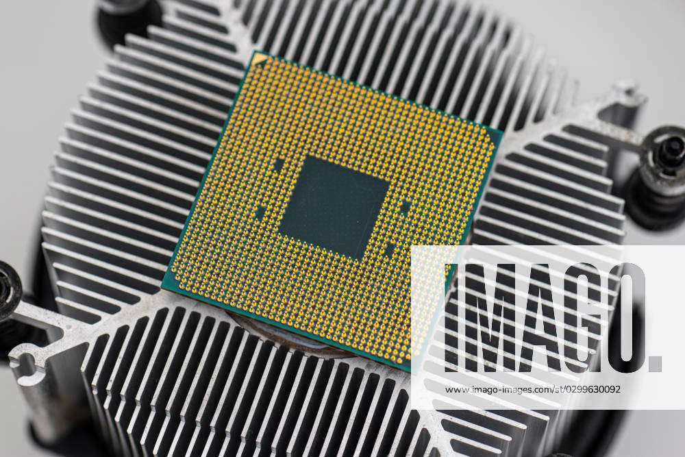 Back of a AMD socket AM4 CPU mounted on a cooler. Back of a AMD socket ...