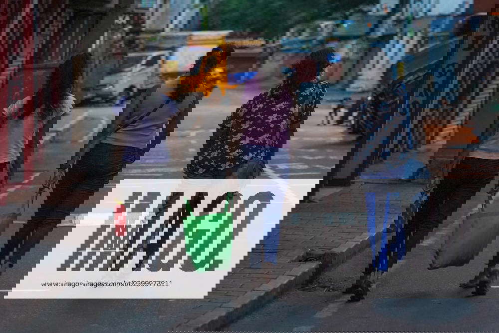 Daily Life In Colombo Shoppers carry bags on the street in Colombo, Sri