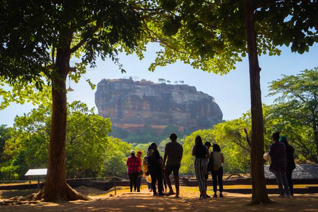 Foreign and local visitors visit to witness the Sigiriya fortress ...