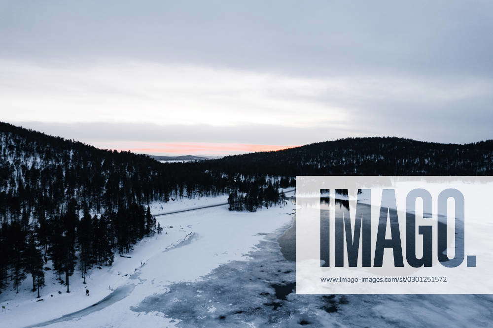 Frozen lake in winter forest Frozen lake with coniferous trees and ...