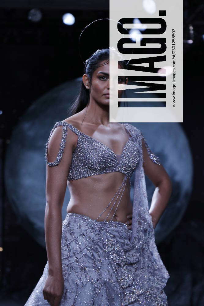 NEW DELHI, INDIA JULY 31 A model walks on the ramp for designer