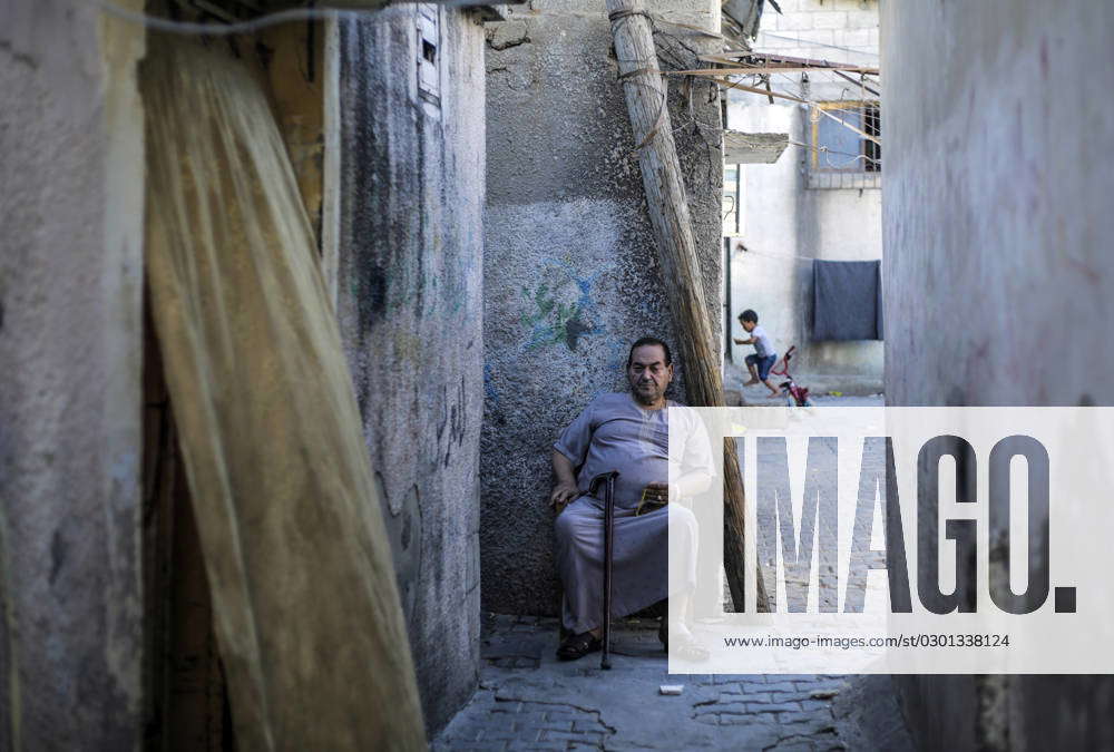 Gaza City, The Gaza Strip, Palestine: A Palestinian refugee sits ...