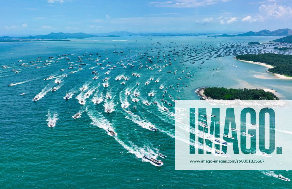 YANGJIANG, CHINA - AUGUST 16: Aerial view of fishing boats setting sail ...