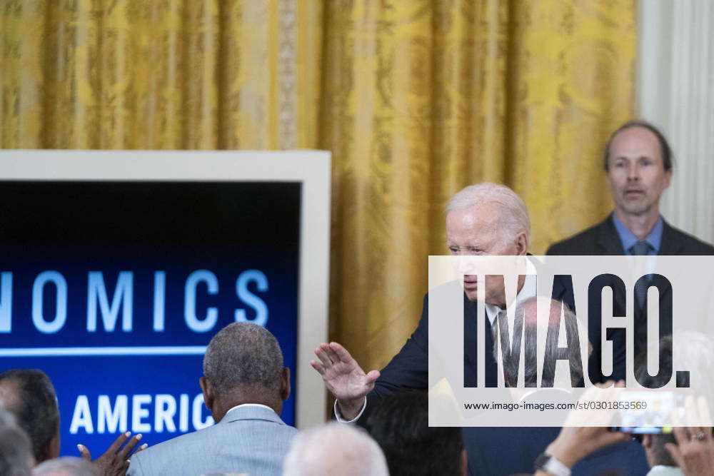 President Joe Biden waves to Democratic members of congress after an ...