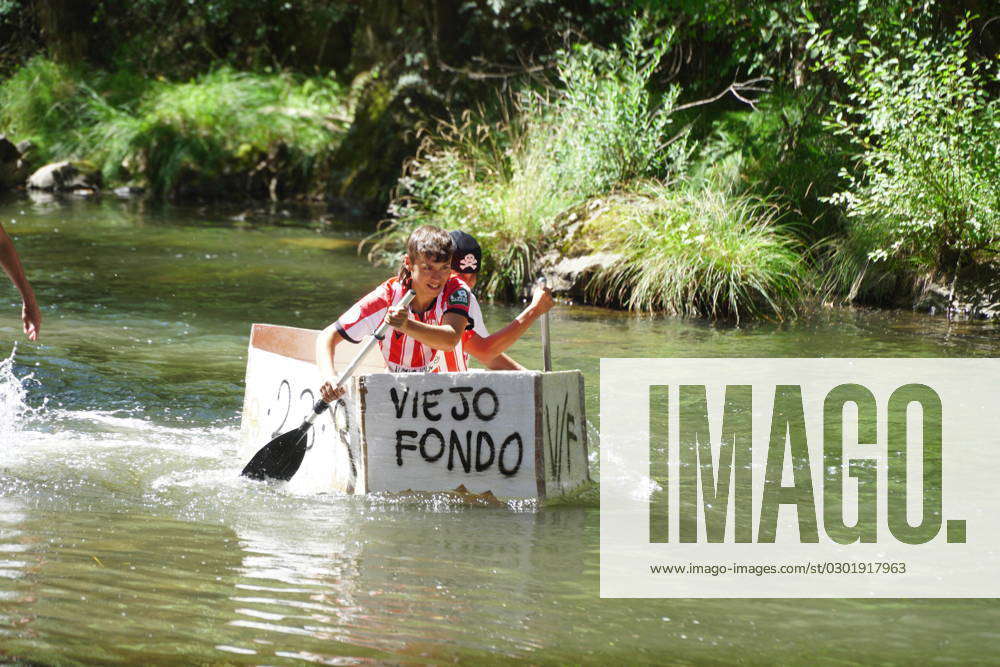 First Cardboard Boat Race - Spain Several people in a cardboard boat ...