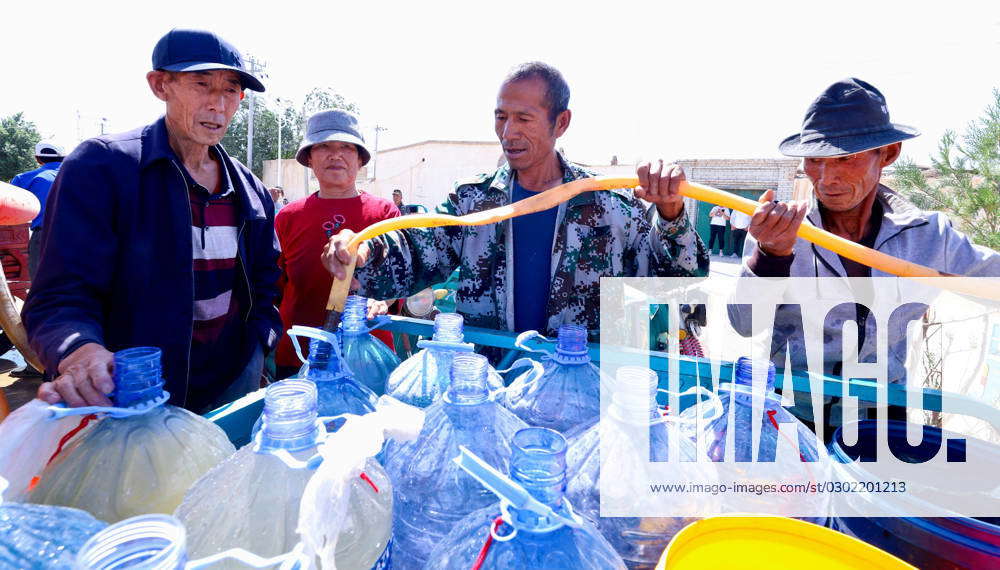 Drought in Zhangye Drought relief workers inject water into a water ...