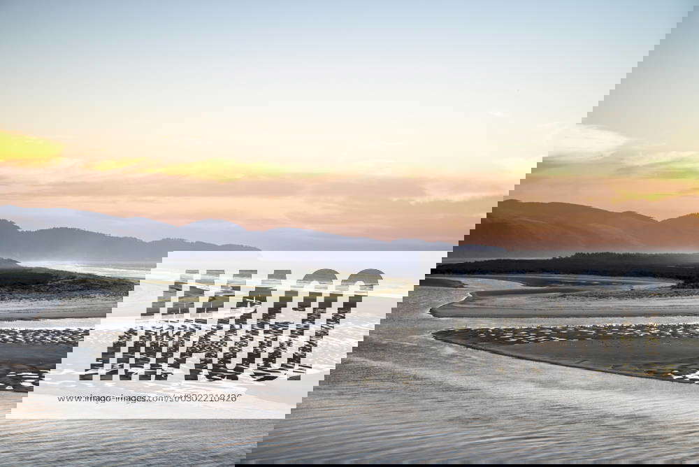 USA, Oregon, Oceanside. Low tide creating patterns in the sand