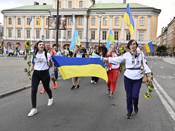 STOCKHOLM 20230824 People with yellow flags take part in the ...