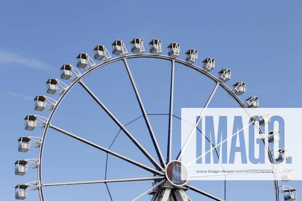 Ferris wheel with Hamburg City coat of arms before blue Sky at Summer ...