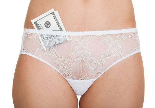Woman with cash in panties, Close-up of a woman wearing lingerie with  banknotes in panties