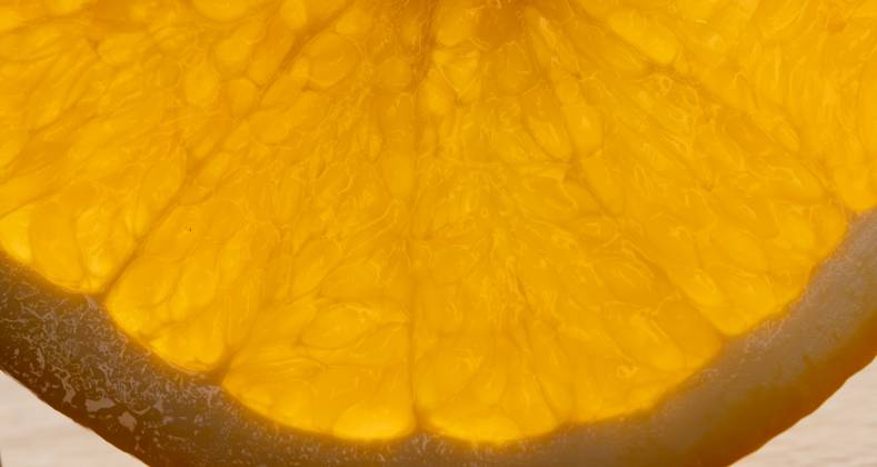 Micro close up of sliced orange and copy space Micro close up of sliced ...