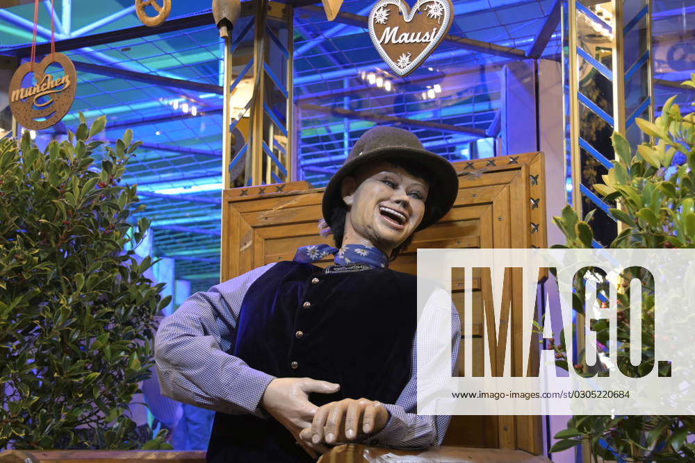 Oktoberfest ride maze during evening night walk over the Wiesn of the ...