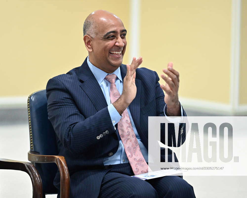 Dr. Ravi Chaudhary laughs during his swearing-in ceremony as the ...