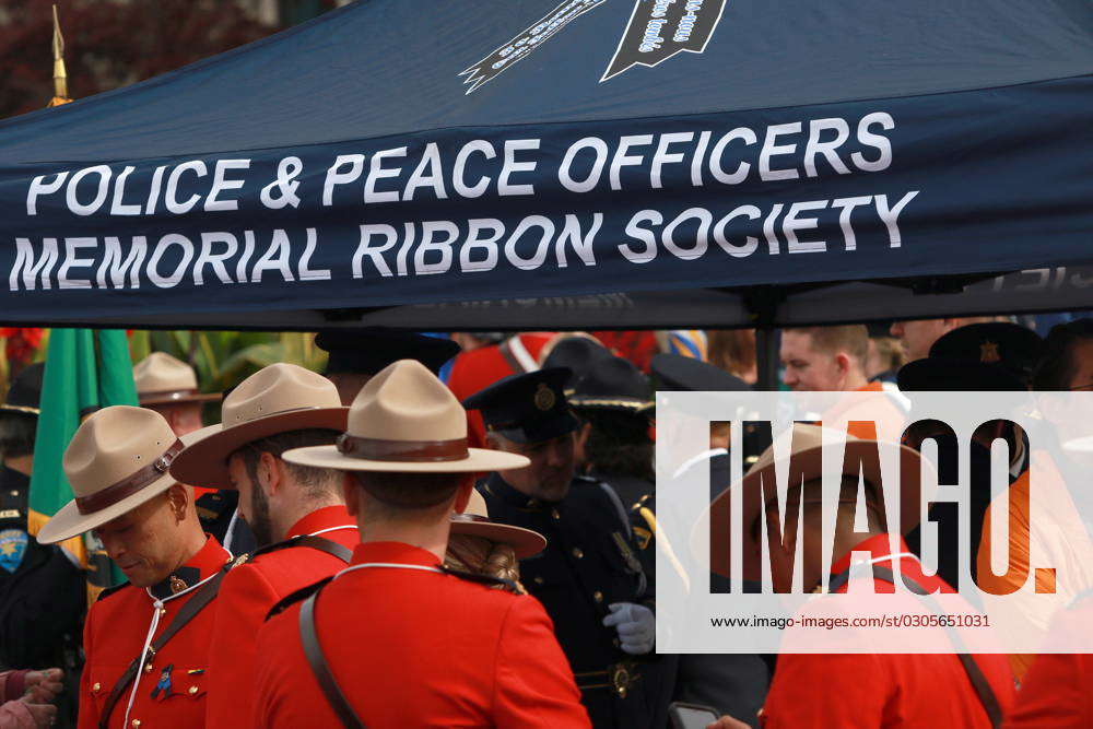 Rcmp Ribbons VICTORIA, BC, CAN: RCMP members stand by the tent for the police and ...