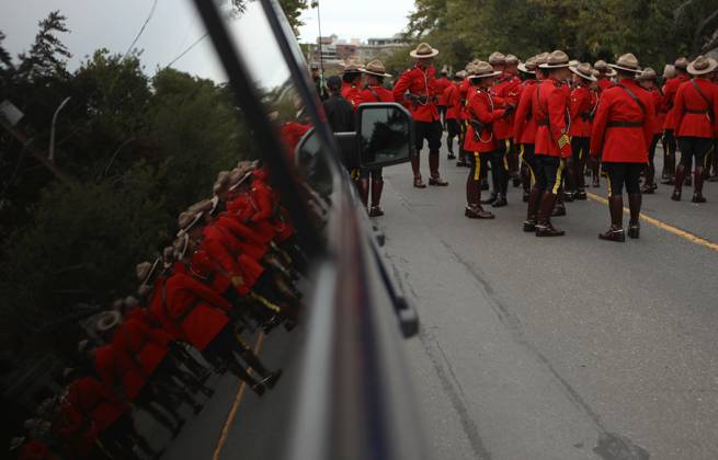 Rcmp Ribbons VICTORIA, BC, CAN: RCMP members stand by the tent for the police and ...