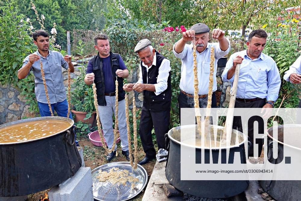 October 1, 2023, Diyarbakir, Turkey: Villagers dip walnuts lined up on ...