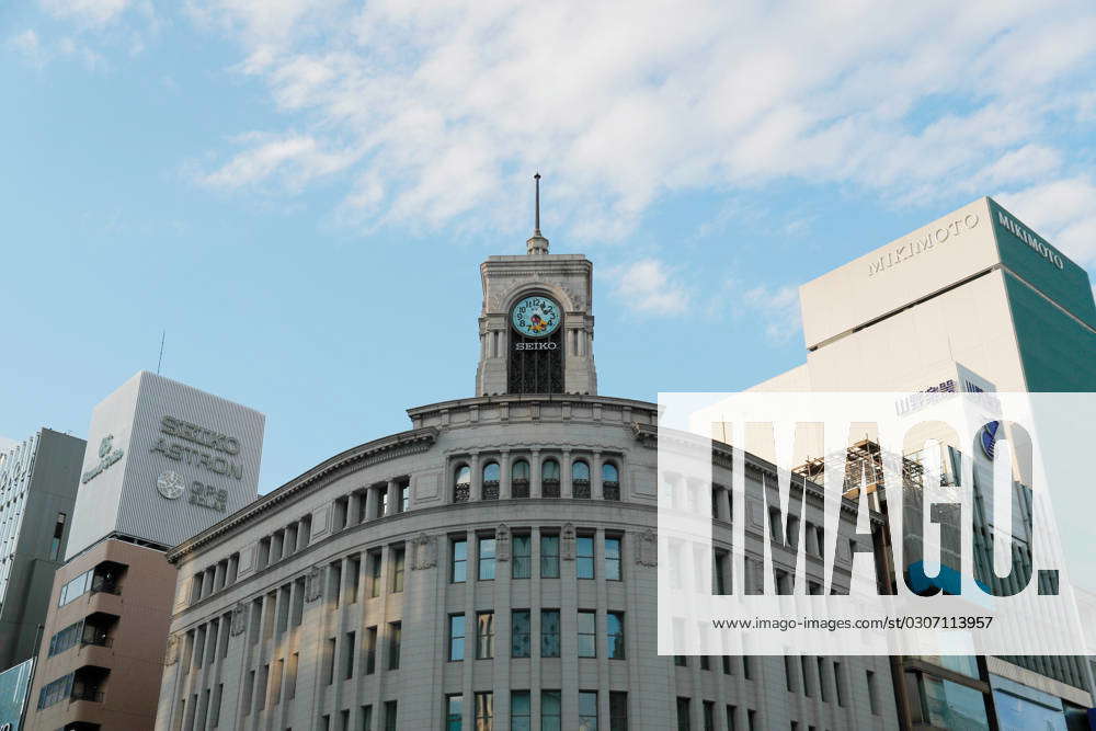 A Mickey Mouse clockface is displayed on the famous clock tower on