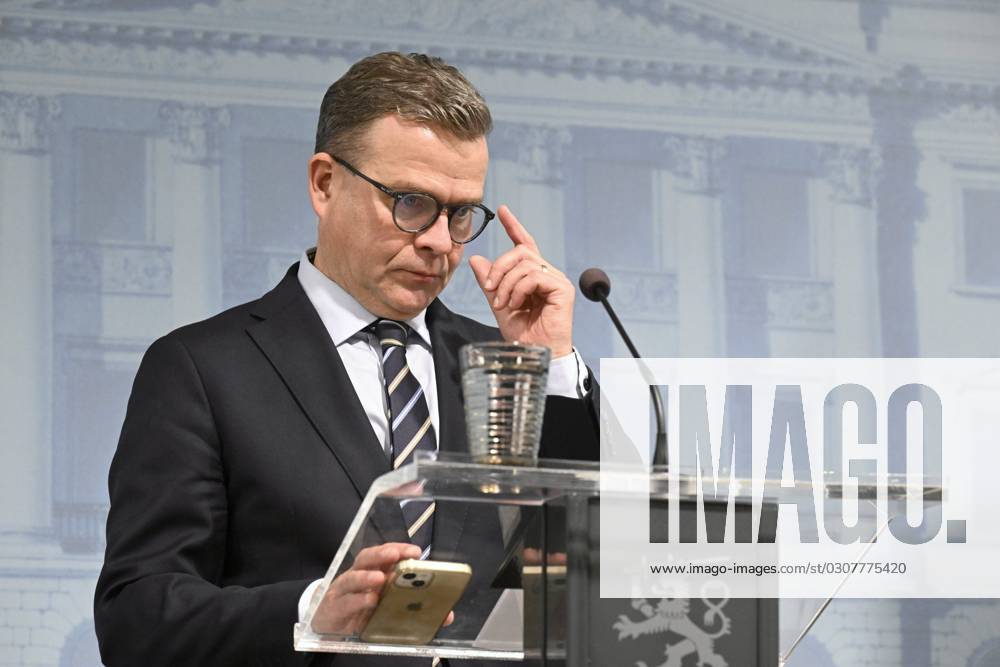Finnish Prime Minister Petteri Orpo reacts during a press conference in