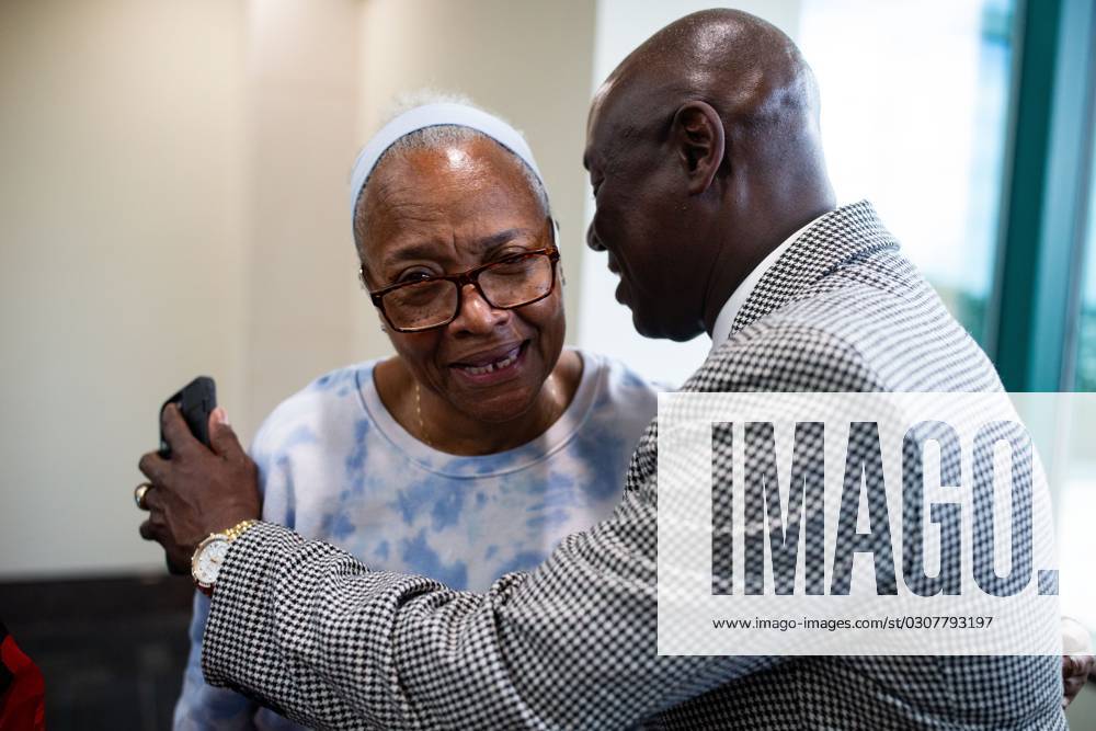 Syndication Tallahassee Democrat Attorney Ben Crump hugs Marsha Ervin