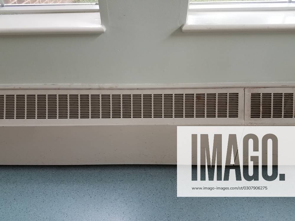 Some baseboard heating vents and a blue floor , 32265428, baseboard