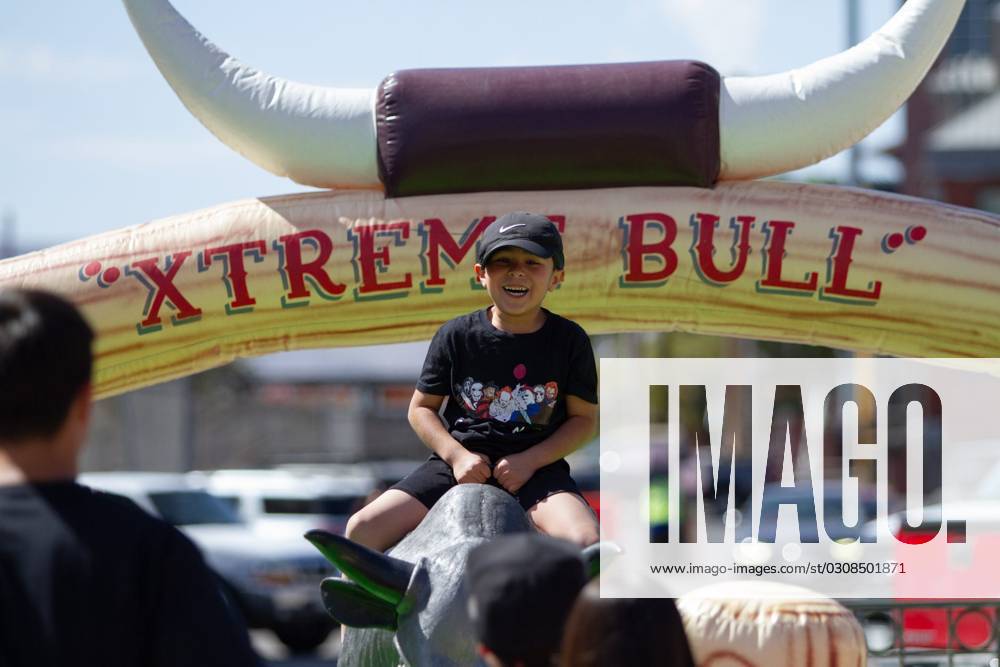 Syndication El Paso Times A child rides a mechanical bull during El