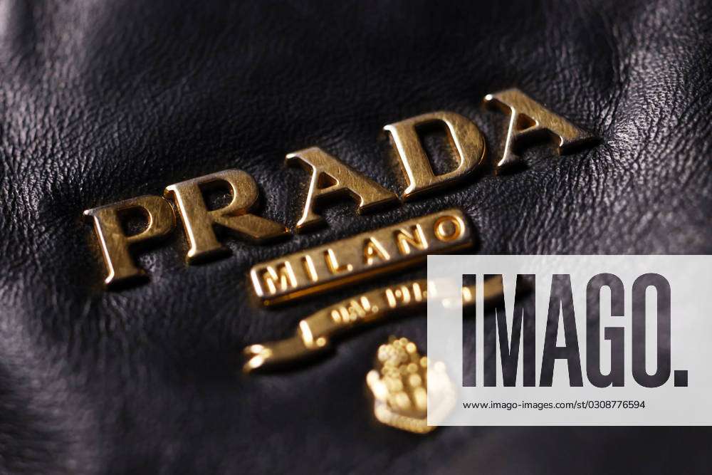 The logo of the Italian fashion and leather goods brand Prada on a Prada  leather bag