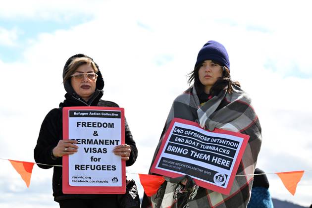 Refugee Rally REFUGEE RALLY CANBERRA, Protesters hold signs during a rally for ...