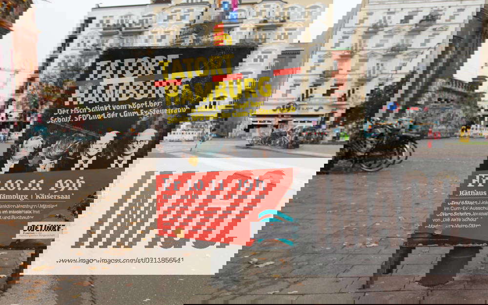 On a lamppost is a poster of the party The Left On it is a discussion