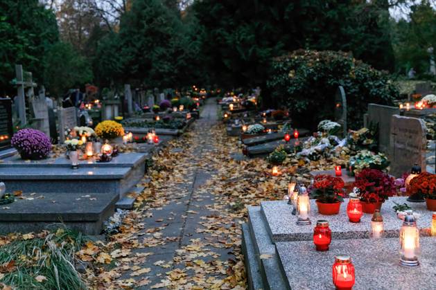 November 1 2023 Warsaw Poland Flowers And Lit Candles Stand On The