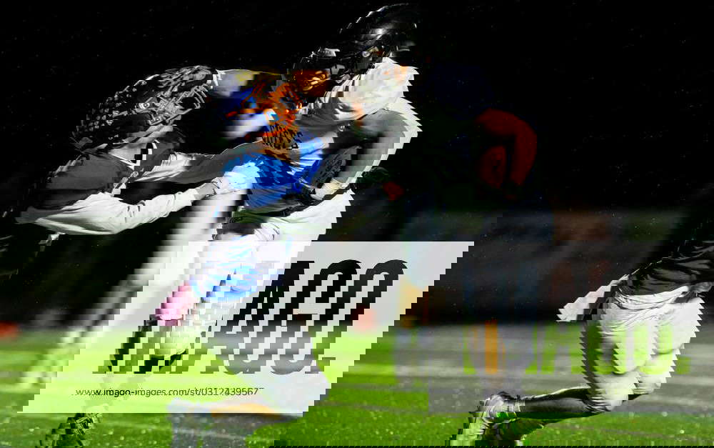 Syndication White Pigeon s Caleb Lane stiff arms a