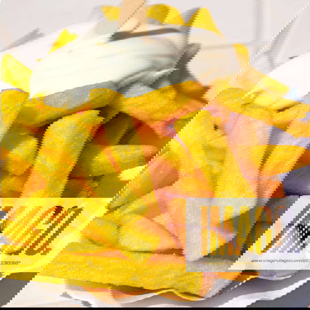 Pommes Frites yellow pommes frites with mayonnaise in closeup