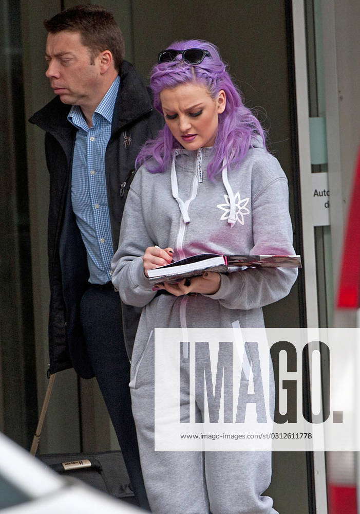 Perrie Edwards arrives at Glasgow airport wearing a grey onsie ahead of