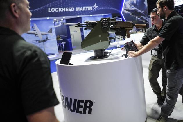 Security Showcase For Rifle Defense And Security 2023 Exhibition In Bangkok. Guns are displayed at ...