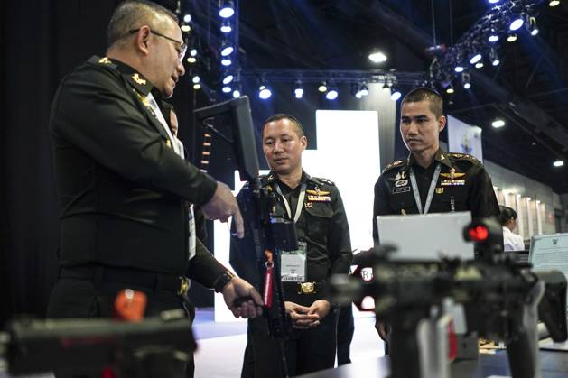 Security Showcase For Rifle Defense And Security 2023 Exhibition In Bangkok. Guns are displayed at ...