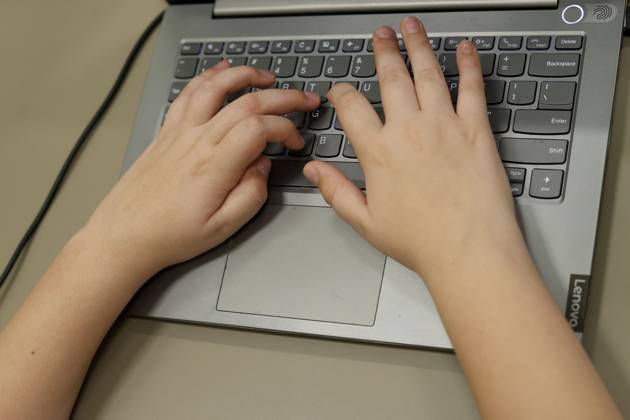 November 8, 2023, Tampa, Florida, USA: Evan Rowlands, 10, looks at his ...