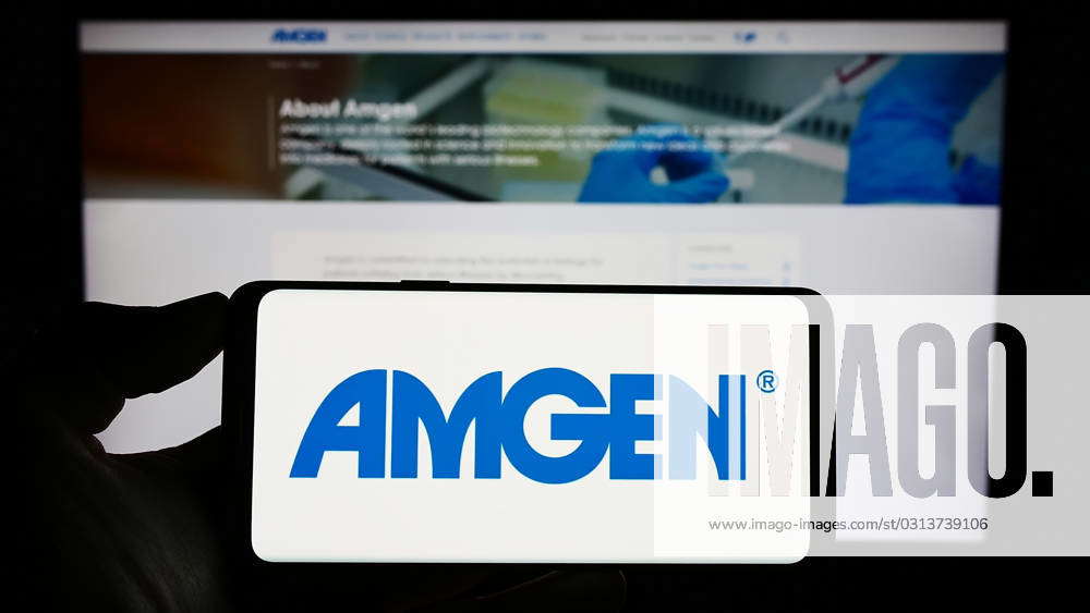 Person Holding Smartphone With Logo Of US Biopharmaceutical Company ...