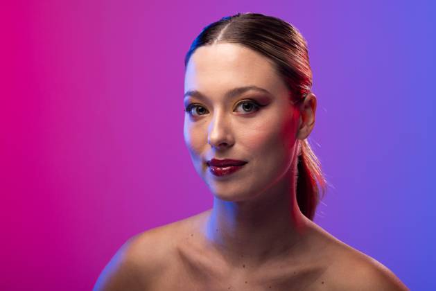 Portrait Of Caucasian Woman Wearing Red Lipstick And Blue Nail Polish