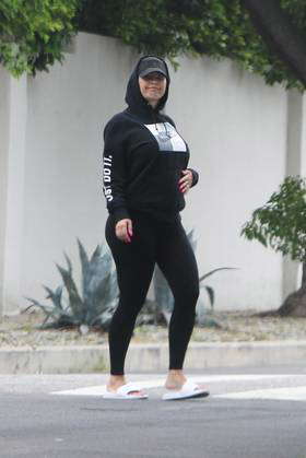 EXCLUSIVE Pregnant Amber Rose pops out to some run errands in slides yoga pants and a hoodie with