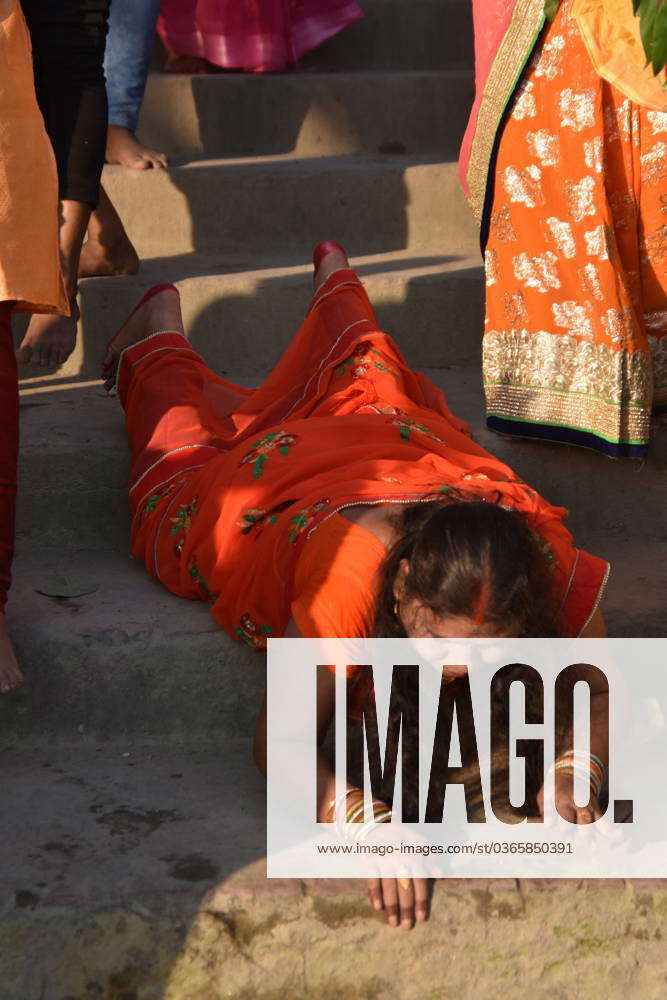 India Chhath celebration at the Ganges Hindu devotees pray with sweets