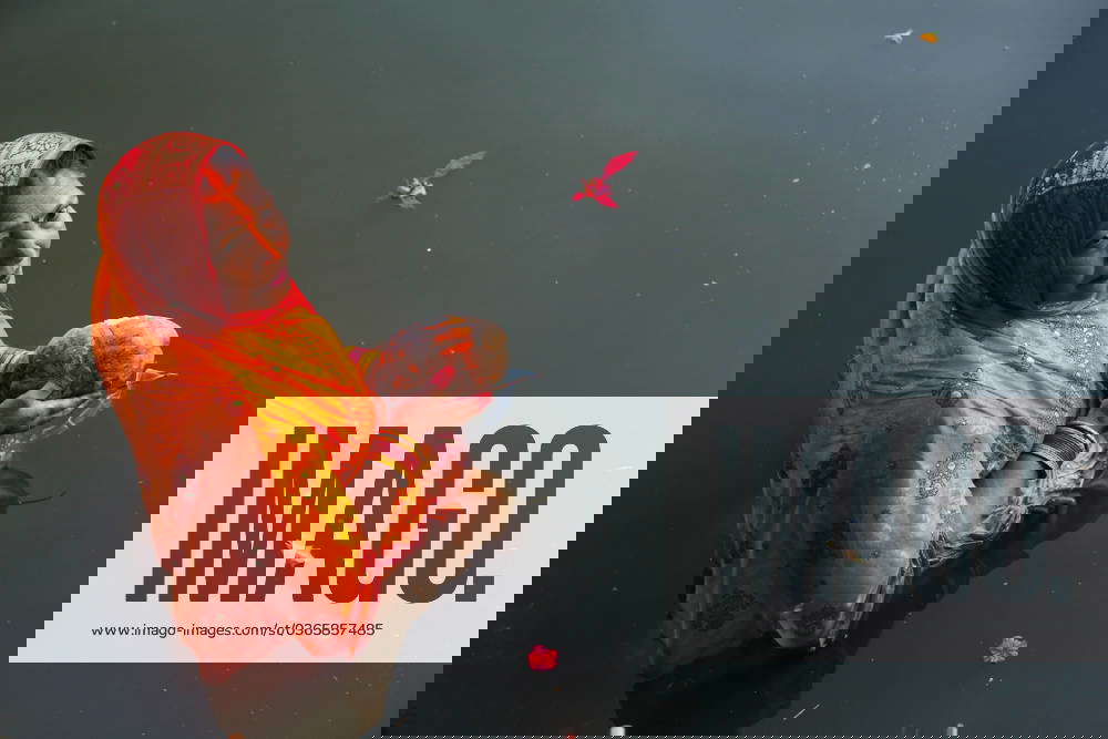 Chhath rituals in Nepal A Nepali Hindu devotee stands on the edge of