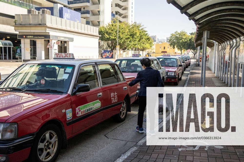 Hong Kong Taxi Drivers Set To Strike Wednesday A women boarding a taxi ...