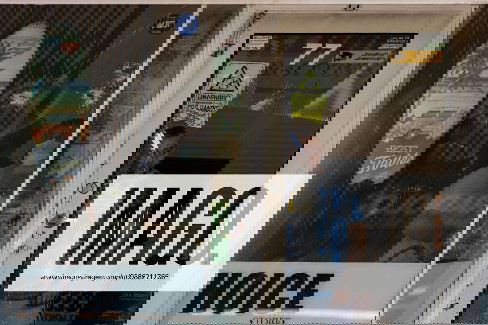 TOBACCO SHOP FIRE MELBOURNE, People assess the damages at a tobacco