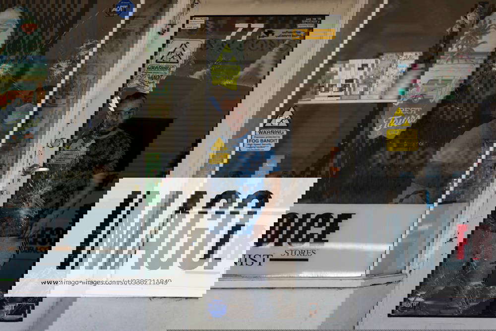 TOBACCO SHOP FIRE MELBOURNE, People assess the damages at a tobacco