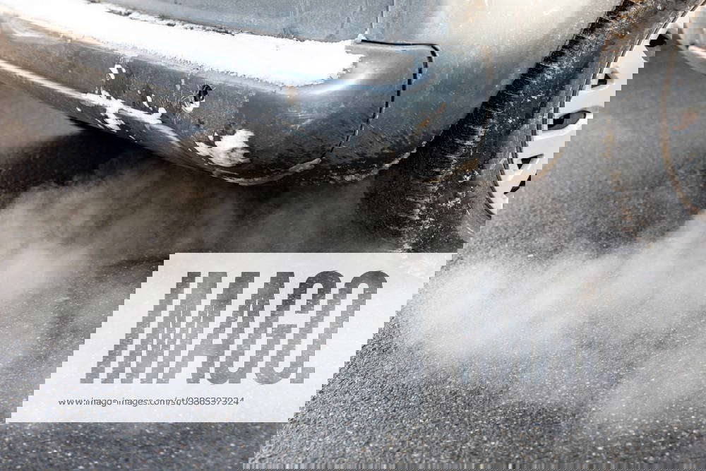 A car exhaust pipe seen discharging smoke in the centre of Krakow. The