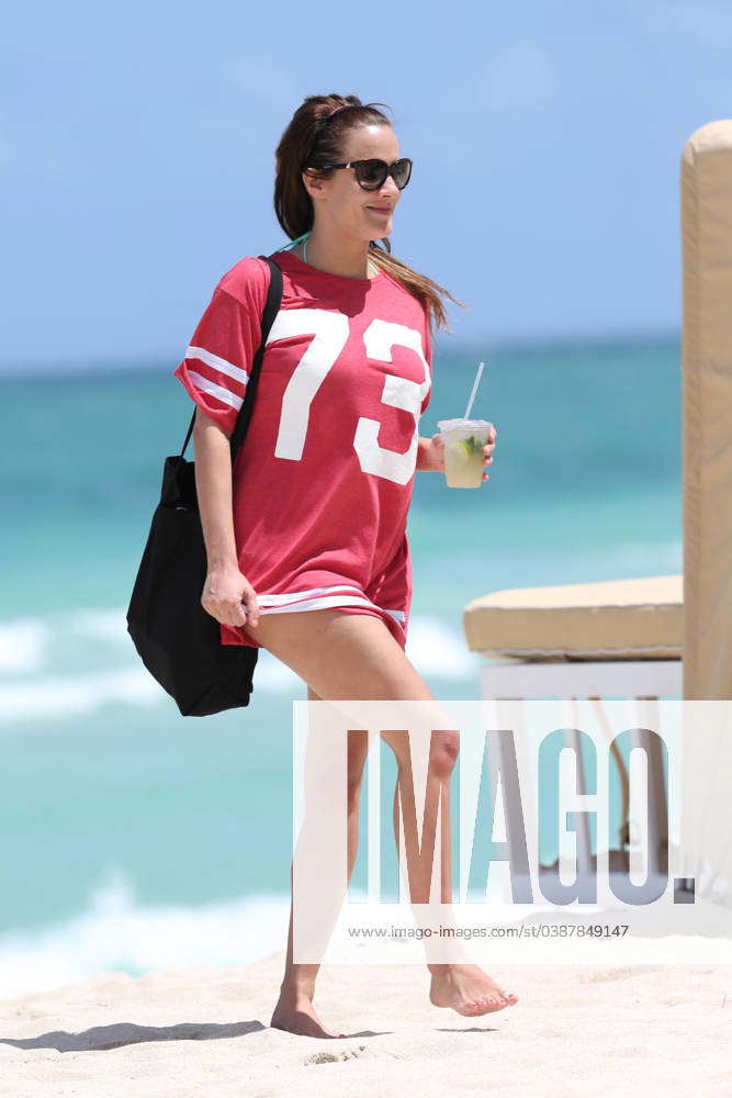 Caroline Flack wears an American football style t-shirt as she heads to ...