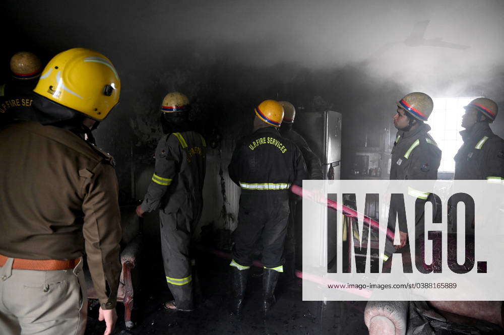 NOIDA, INDIA – JANUARY 14: A team of Firefighters trying to extinguish ...