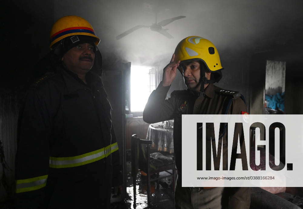 NOIDA, INDIA – JANUARY 14: A team of Firefighters trying to extinguish ...